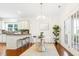 Dining area with stylish clear chairs, a modern chandelier, and access to a patio at 188 Donning Dr, Summerville, SC 29483