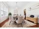 Bright dining room featuring detailed trim work, wood floors, and a modern chandelier at 188 Donning Dr, Summerville, SC 29483