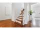 A view of the entryway with wood floors, white trim, and a staircase at 188 Donning Dr, Summerville, SC 29483