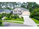 Two-story home with a manicured front yard, attached two car garage, and charming light blue front door at 188 Donning Dr, Summerville, SC 29483