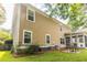 Exterior view of home features a screened porch and green lawn at 188 Donning Dr, Summerville, SC 29483