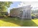 Exterior view of home features a screened porch and green lawn at 188 Donning Dr, Summerville, SC 29483