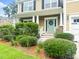 Inviting front porch with lush landscaping, decorative wreath, and a classic design at 188 Donning Dr, Summerville, SC 29483