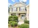 Charming front porch with decorative columns, a stylish front door, and manicured landscaping at 188 Donning Dr, Summerville, SC 29483