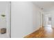 Hallway with hardwood floors and neutral paint at 188 Donning Dr, Summerville, SC 29483