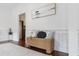 Hallway nook with woven bench seat, decorative pillows, and view to the kitchen at 188 Donning Dr, Summerville, SC 29483