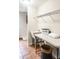 Laundry room with utility sink, folding table, shelving, and tile flooring at 188 Donning Dr, Summerville, SC 29483