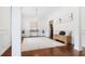 Spacious living room featuring white columns, detailed trim work, wood floors, and a woven bench seat at 188 Donning Dr, Summerville, SC 29483