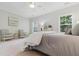 Main bedroom with carpet, neutral decor, sitting area, and windows offering outside views at 188 Donning Dr, Summerville, SC 29483