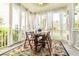 Covered porch with table, chairs, and a colorful rug at 188 Donning Dr, Summerville, SC 29483