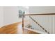 Staircase with wood steps and white railings lead to the upper level of the home at 188 Donning Dr, Summerville, SC 29483