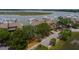 Scenic aerial view of waterfront townhomes and a marina filled with boats at a coastal community at 1919 Marsh Oak Ln, Seabrook Island, SC 29455
