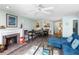Open-concept living room with fireplace, dining area, and comfortable seating, creating an inviting space at 1919 Marsh Oak Ln, Seabrook Island, SC 29455