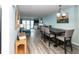 Well-lit living room and dining area featuring stylish decor, a fireplace, and ample seating at 1919 Marsh Oak Ln, Seabrook Island, SC 29455