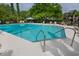 Serene community pool showcasing sparkling water, inviting lounge chairs, and carefully manicured landscaping at 1919 Marsh Oak Ln, Seabrook Island, SC 29455