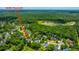 An aerial view of the property, showing lake, trees, and community amenities at 2026 Thornhill Dr, Summerville, SC 29485