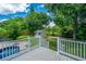 View of the backyard from the deck featuring a shed and green landscaping at 2026 Thornhill Dr, Summerville, SC 29485