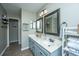 Bathroom boasts a dual vanity with framed mirrors and a neutral color scheme at 2026 Thornhill Dr, Summerville, SC 29485