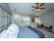 Vaulted ceiling bedroom with wood flooring and black iron bed frame at 2026 Thornhill Dr, Summerville, SC 29485