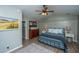 Vaulted ceiling bedroom with wood flooring, paneled wall, and black iron bed frame at 2026 Thornhill Dr, Summerville, SC 29485
