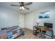 Cozy bedroom with a ceiling fan, closet and modern desk workstation with decorative lighting at 2026 Thornhill Dr, Summerville, SC 29485