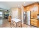 Updated kitchen featuring stainless steel refrigerator and center island with wooden base and white countertop at 2026 Thornhill Dr, Summerville, SC 29485