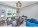 Cozy living room featuring a comfortable sofa, accent chair, and natural light at 2026 Thornhill Dr, Summerville, SC 29485