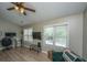 Comfortable living room features hardwood floors, fan, and window views at 2026 Thornhill Dr, Summerville, SC 29485