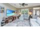 Comfortable living room featuring neutral sofas, a large TV, and wood floors at 2026 Thornhill Dr, Summerville, SC 29485