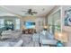 Comfortable living room featuring neutral sofas, a large TV, and wood floors at 2026 Thornhill Dr, Summerville, SC 29485