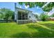 Back exterior view of the house shows the screen porch and deck at 2026 Thornhill Dr, Summerville, SC 29485