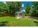 Backyard storage shed in the backyard with surrounding green grass at 2026 Thornhill Dr, Summerville, SC 29485