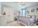 Bright bedroom with a grey frame bed, shelves and natural light at 207 Center Hill Ct, Summerville, SC 29485