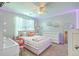 Light-filled pink bedroom with vanity area, decorative touches, and a cozy bed at 207 Center Hill Ct, Summerville, SC 29485