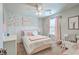 Charming bedroom featuring a floral accent wall and a cozy bed at 207 Center Hill Ct, Summerville, SC 29485