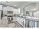 Bright kitchen with granite countertops, modern appliances, and ample cabinet space at 207 Center Hill Ct, Summerville, SC 29485