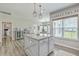 A kitchen featuring a gray island with a granite countertop and modern pendant lights at 207 Center Hill Ct, Summerville, SC 29485