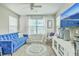 Bright living room featuring a comfortable blue sofa and stylish decor at 207 Center Hill Ct, Summerville, SC 29485