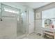 Bright ensuite bathroom with a glass enclosed shower, vanity and picture window at 207 Center Hill Ct, Summerville, SC 29485