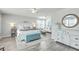 Spacious main bedroom featuring a decorative chest, ample natural light, and a cozy sitting area at 207 Center Hill Ct, Summerville, SC 29485