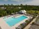 Aerial view of community pool with ample seating, large swimming area, and a covered seating area and surrounding trees at 209 Hayworth Rd, Summerville, SC 29486