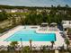 Aerial view of community pool and splashpad area offering a refreshing and relaxing escape for residents with nearby houses at 209 Hayworth Rd, Summerville, SC 29486