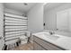 Clean bathroom with white fixtures, striped shower curtain, and neutral tile flooring at 209 Hayworth Rd, Summerville, SC 29486