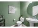 Powder room featuring vibrant green walls and modern fixtures for a stylish and refreshed aesthetic at 209 Hayworth Rd, Summerville, SC 29486