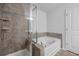 Bathroom featuring a tiled shower and a separate soaking tub for a spa-like experience at 209 Hayworth Rd, Summerville, SC 29486