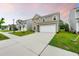 View of a two-story home with a wide driveway and a manicured lawn in a suburban neighborhood at 209 Hayworth Rd, Summerville, SC 29486