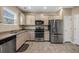Modern kitchen with stainless steel appliances, granite countertops, and a large window for natural light at 209 Hayworth Rd, Summerville, SC 29486