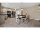 Bright eat-in kitchen features stainless steel appliances, granite countertops, and a stylish tiled floor at 209 Hayworth Rd, Summerville, SC 29486