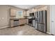 Well-lit kitchen equipped with stainless steel appliances and granite countertops for an appealing aesthetic at 209 Hayworth Rd, Summerville, SC 29486
