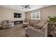 Cozy living room featuring comfortable seating, a fireplace, and a ceiling fan at 209 Hayworth Rd, Summerville, SC 29486